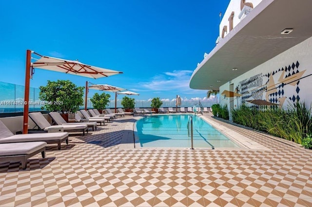 view of swimming pool featuring a patio