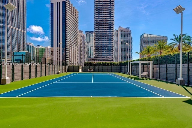 view of sport court with basketball hoop