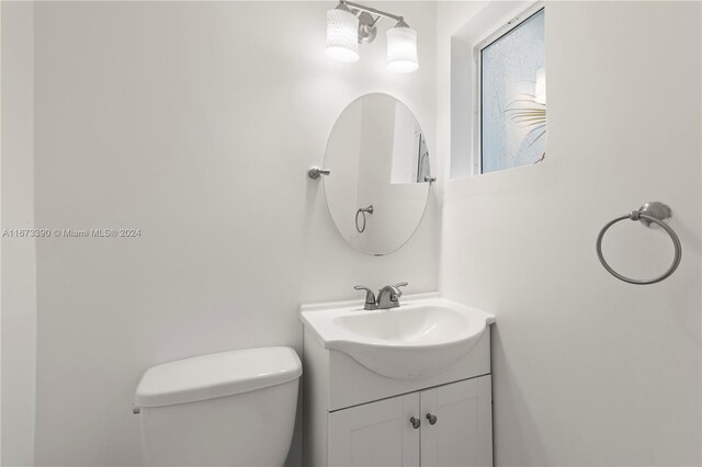 bathroom featuring vanity and toilet