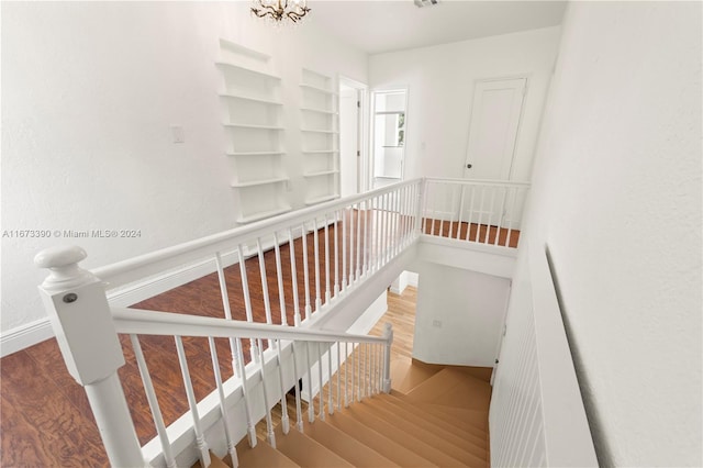 stairs featuring wood-type flooring