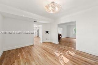 unfurnished room with hardwood / wood-style floors