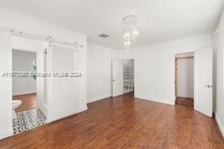 empty room featuring dark hardwood / wood-style flooring