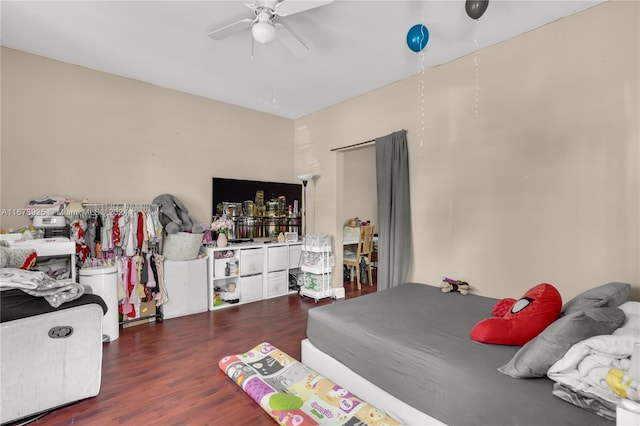 bedroom featuring dark wood-type flooring and ceiling fan