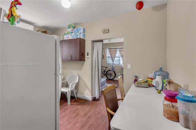 dining area with dark hardwood / wood-style floors