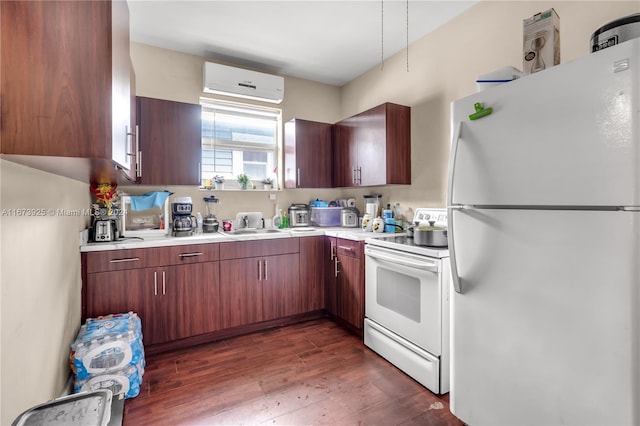 kitchen with dark hardwood / wood-style flooring, white appliances, and an AC wall unit