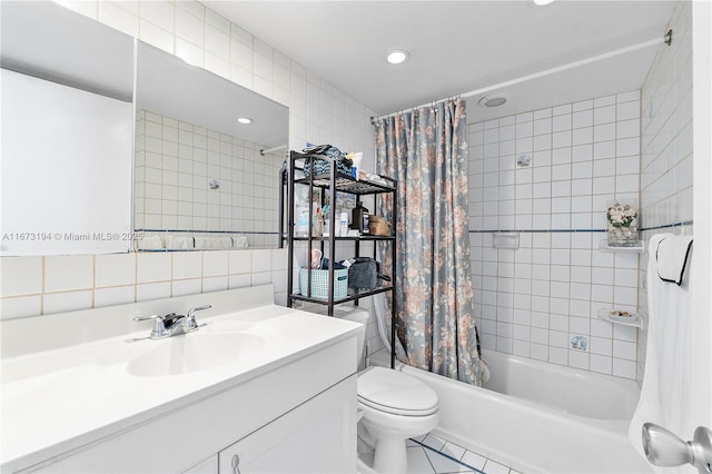 full bathroom featuring toilet, backsplash, tile walls, shower / tub combo, and vanity