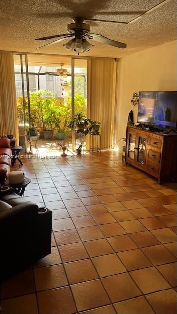 tiled living room with ceiling fan and a textured ceiling