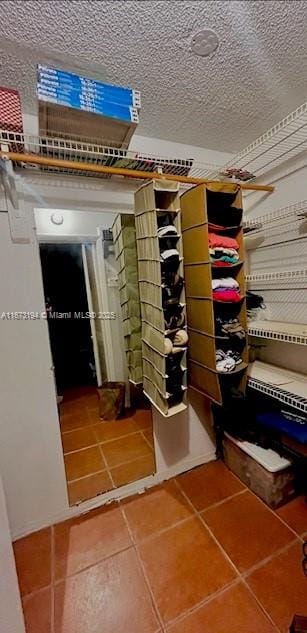 spacious closet with tile patterned flooring