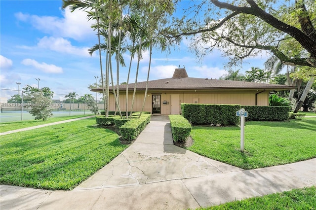 single story home featuring a front yard