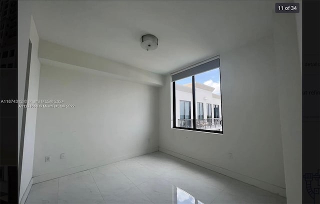 301 Altara Ave Unit Uph1008, Coral Gables, FL 33146 - spare room featuring baseboards