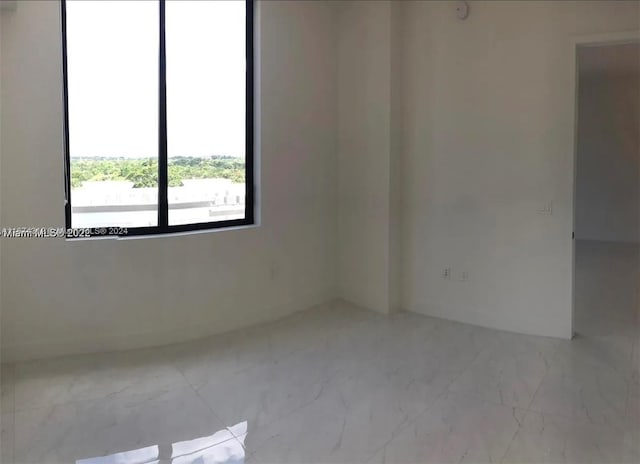 301 Altara Ave Unit Uph1008, Coral Gables, FL 33146 - spare room with marble look tile flooring