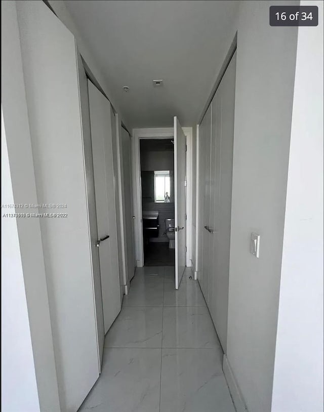 301 Altara Ave Unit Uph1008, Coral Gables, FL 33146 - hallway with light marble finish floors