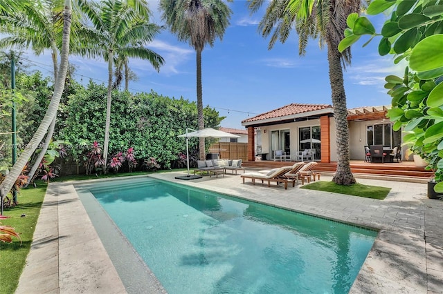 view of pool featuring outdoor lounge area and a patio