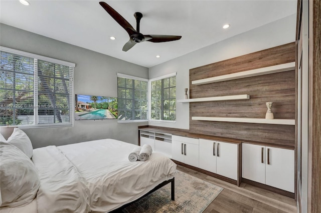 bedroom featuring ceiling fan and light wood-type flooring