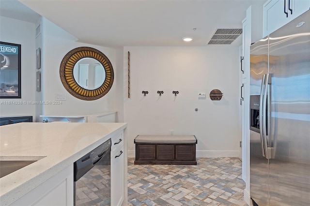 bathroom featuring brick floor, recessed lighting, vanity, visible vents, and baseboards