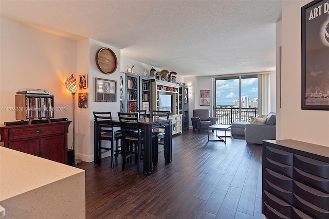 9066 SW 73rd Ct Unit 1205, Miami, FL 33156 - dining area with dark wood-style floors, floor to ceiling windows, and a textured ceiling