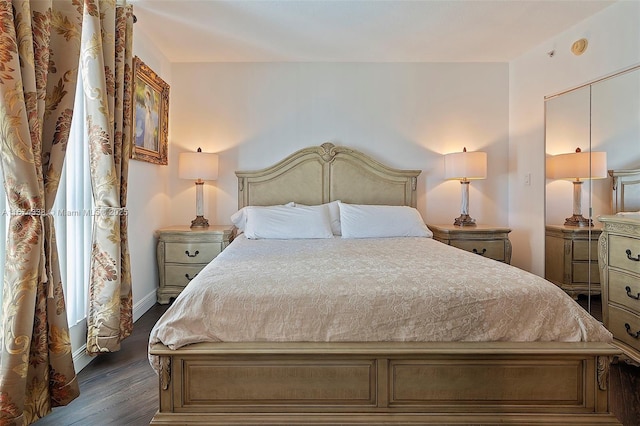 9066 SW 73rd Ct Unit 1205, Miami, FL 33156 - bedroom featuring dark wood-style floors and baseboards