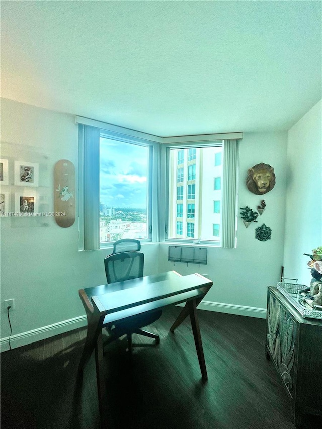 office space with baseboards and dark wood-style flooring