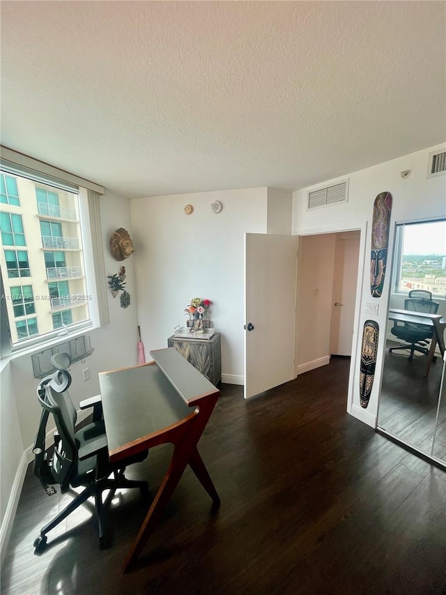9066 SW 73rd Ct Unit 1205, Miami, FL 33156 - dining space with dark wood-style floors, a textured ceiling, an office area, and baseboards