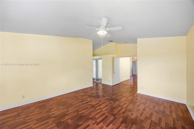 unfurnished room with ceiling fan, vaulted ceiling, and dark hardwood / wood-style floors