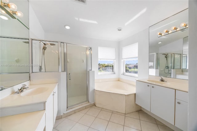 bathroom featuring vanity, shower with separate bathtub, lofted ceiling, and tile patterned floors