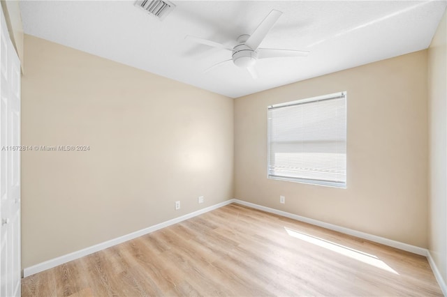 unfurnished room with ceiling fan and light hardwood / wood-style floors