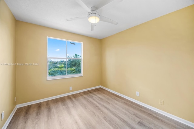 unfurnished room featuring ceiling fan and light hardwood / wood-style floors