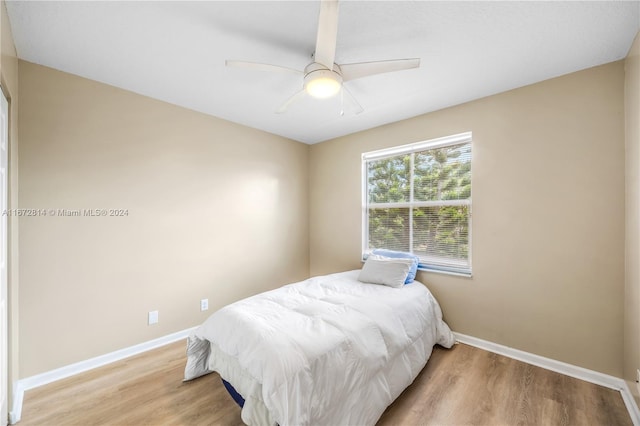 bedroom featuring ceiling fan and wood-type flooring