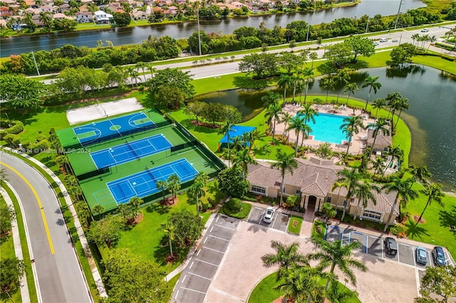 birds eye view of property with a water view