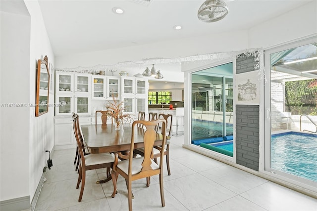 dining space with lofted ceiling