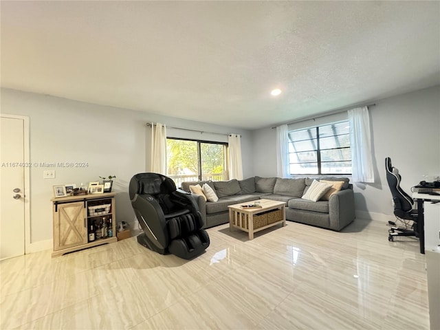 living room with a textured ceiling