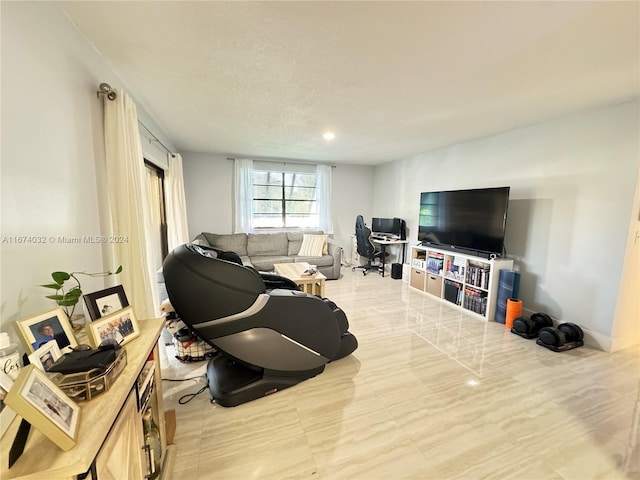 living room featuring a textured ceiling