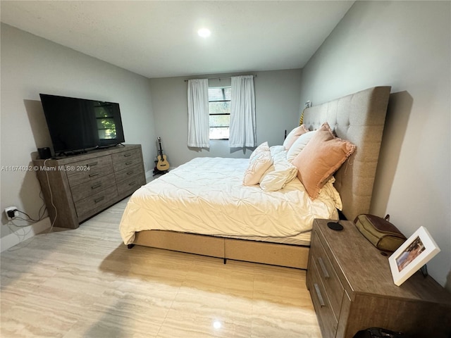 bedroom featuring lofted ceiling