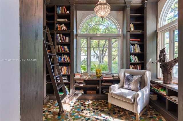 sitting room with an inviting chandelier