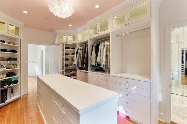 walk in closet featuring light hardwood / wood-style floors