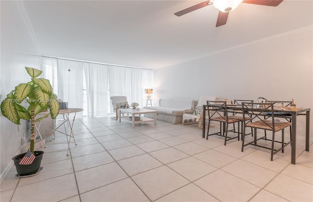 interior space featuring ceiling fan and ornamental molding