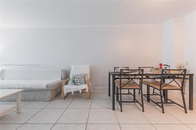 18071 Biscayne Blvd Unit 303, Aventura, FL 33160 - dining space with crown molding and light tile patterned flooring