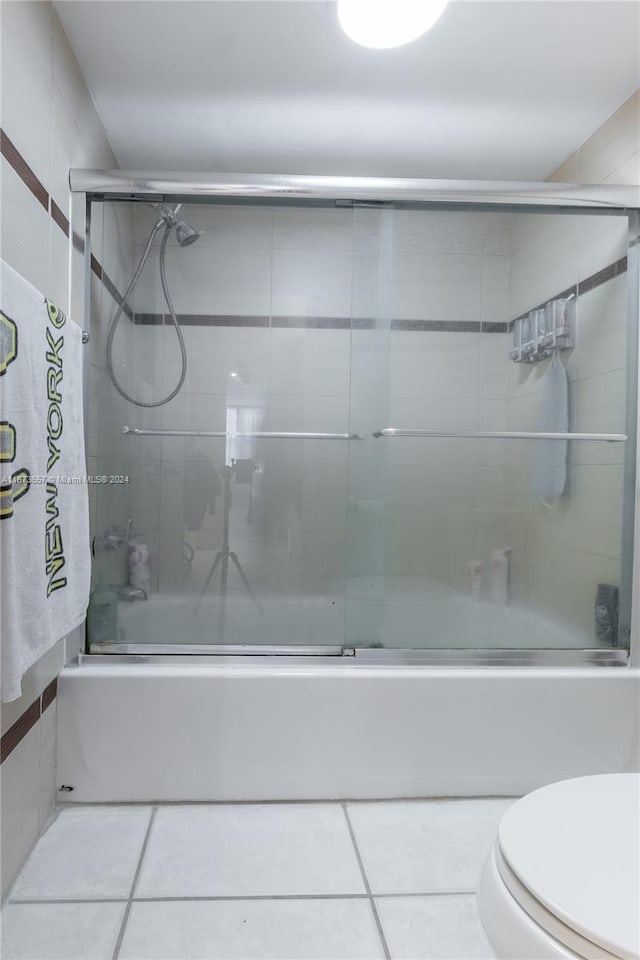 18071 Biscayne Blvd Unit 303, Aventura, FL 33160 - bathroom featuring tile patterned floors, enclosed tub / shower combo, and toilet