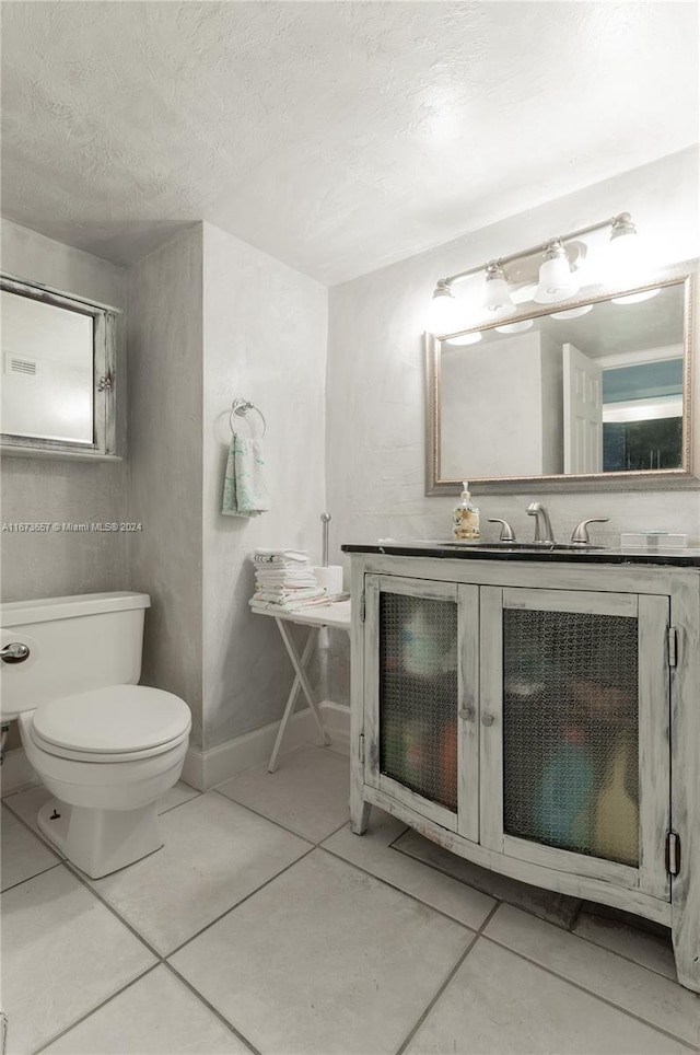 18071 Biscayne Blvd Unit 303, Aventura, FL 33160 - bathroom with a sink, toilet, tile patterned floors, a textured ceiling, and baseboards