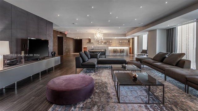 living room with a chandelier and a large fireplace