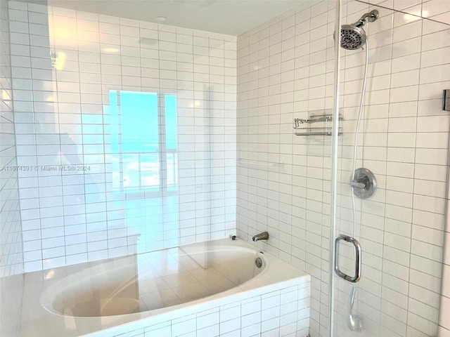 bathroom with shower with separate bathtub