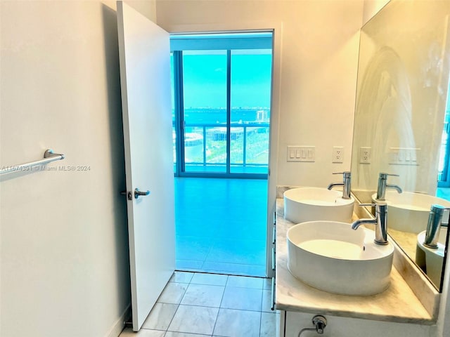 bathroom with tile patterned flooring and vanity