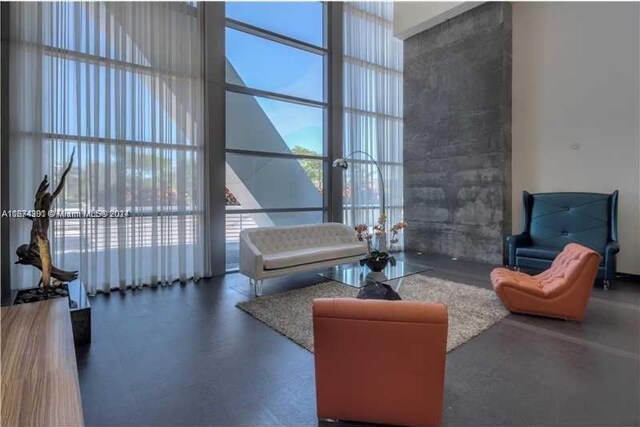 888 Biscayne Blvd Unit 1811, Miami, FL 33132 - living room with a high ceiling and floor to ceiling windows
