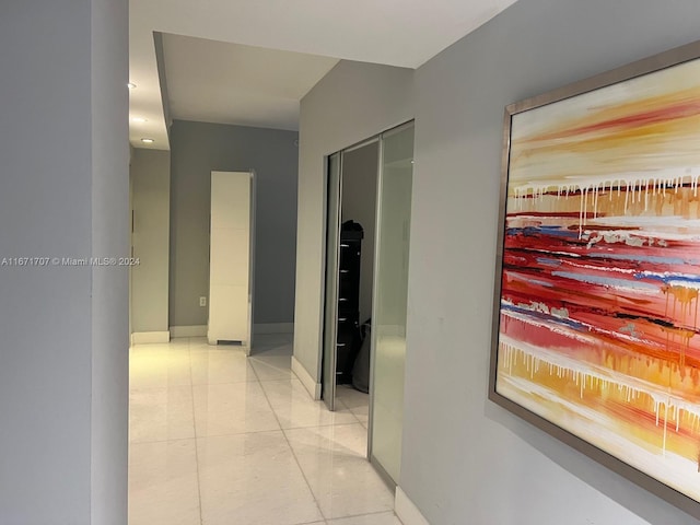 corridor featuring light tile patterned flooring