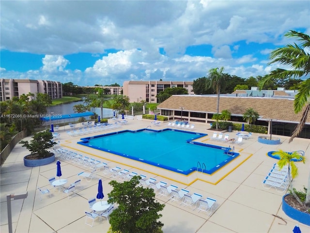 view of swimming pool with a patio area