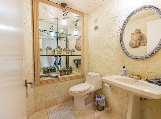 bathroom featuring tile patterned floors and toilet