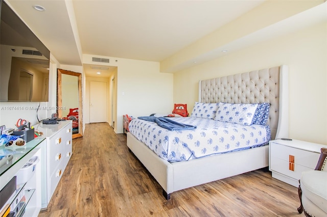 bedroom featuring wood-type flooring