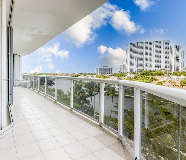 balcony with a view of city and a water view
