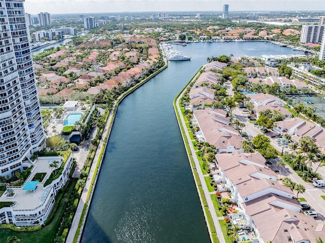 bird's eye view with a residential view, a water view, and a view of city