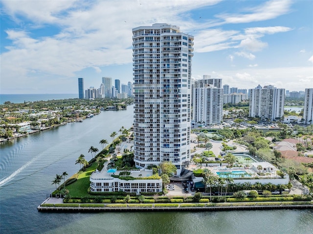 drone / aerial view with a view of city and a water view